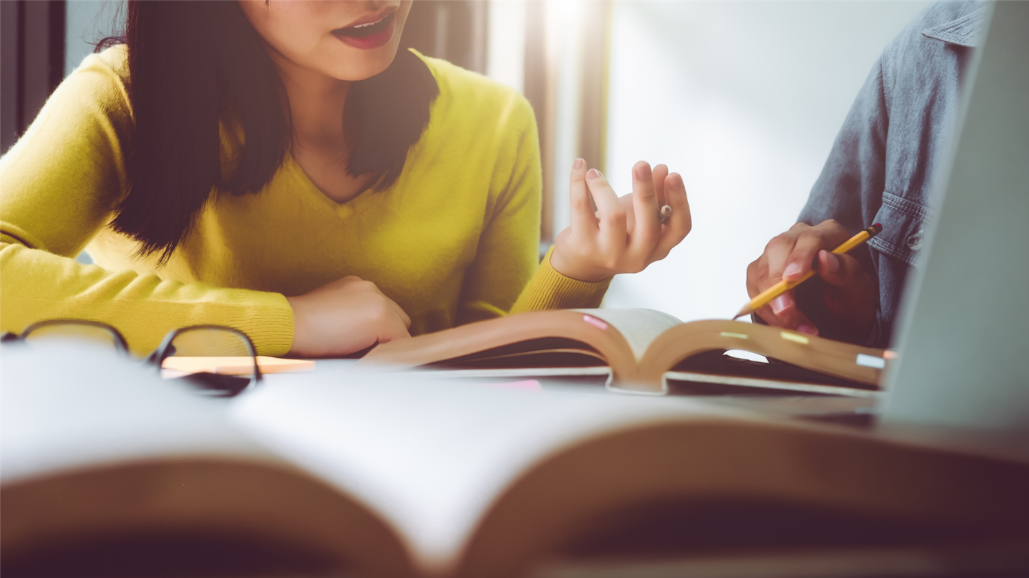 students visit over books and notes